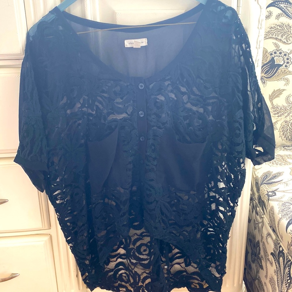 Long crop black lace top. Very flowy.